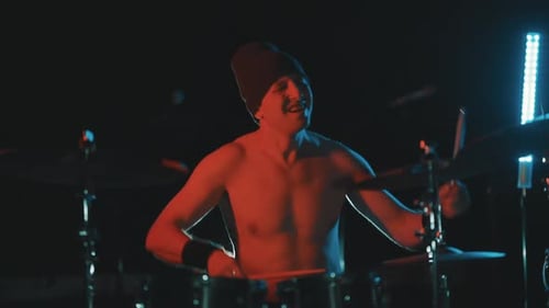 Energetic Drummer Performing a Live Rock Music Concert