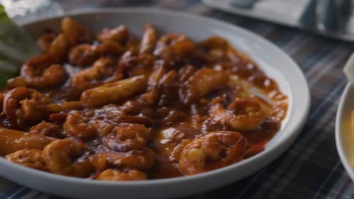 Seafood Dishes on Plates in a Restaurant Close Up Camera Moving