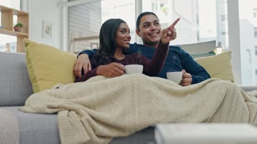 Couple Relaxing on Sofa Together in Modern Home