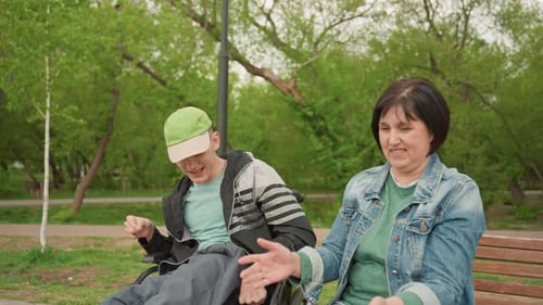 Teen in Wheelchair Plays Guessing Game with Woman