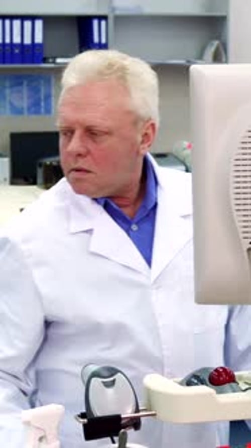 Lab Professional Works with Clinical Equipment