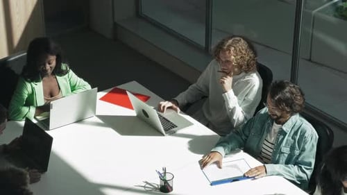 Diverse Team Meeting in Modern Office