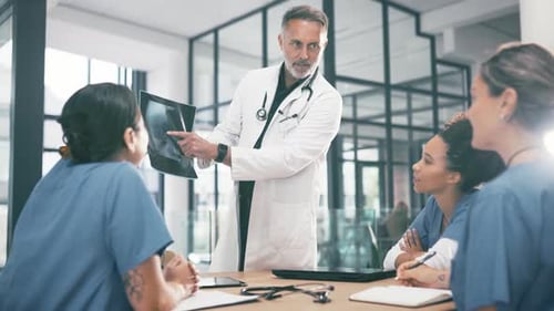 Medical, doctor and team with xray for discussion, analysis and collaboration in hospital or office