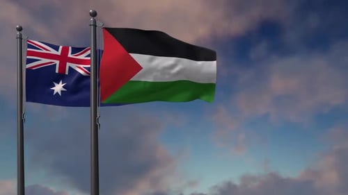 Australian and Palestinian Flags Waving Together against Blue Sky