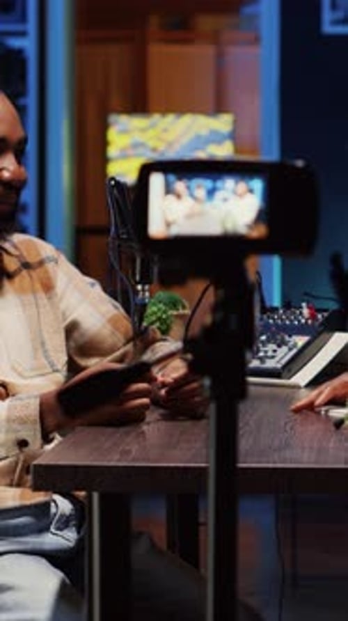 Two Podcasters Recording Live Stream in Studio