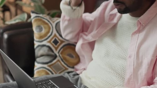 Biracial Man Typing Message on Laptop while Staying at Home