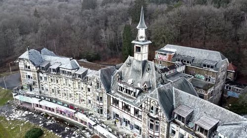 Aerial View of Decaying Building with Graffiti