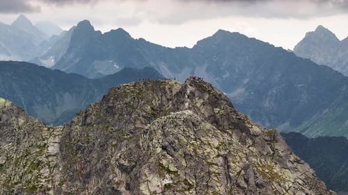 Majestic mountain peak exploration with hikers in breathtaking scenery
