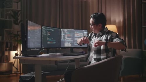 Asian Male Programmer Stretching While Creating Software Engineer Developing App, Program