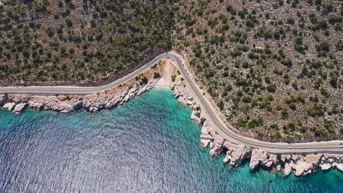 Aerial Video of Mediterranean Coastline with Beach Clear Sea and Winding Road