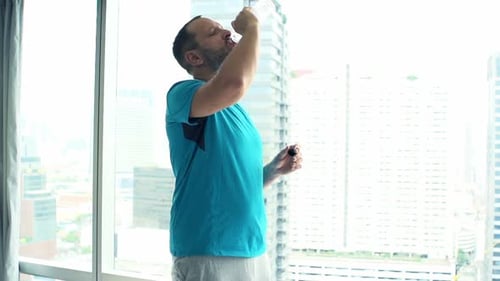 Sporty Man Drinking Water After Workout in Gym, Super 240