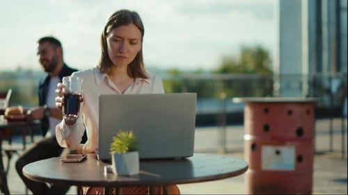 Portrait Beautiful Young Woman Sitting at Table with Laptop in Cafe Drinking Juice Working Online