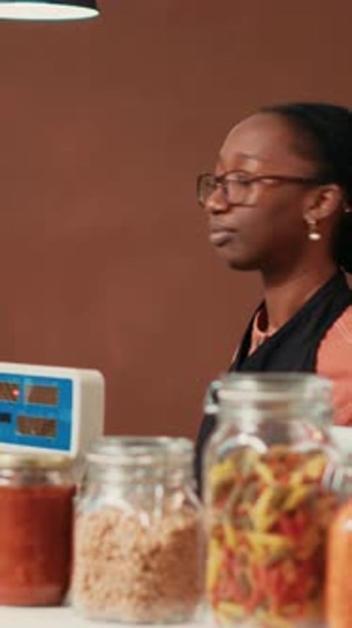 Vertical Video Vendor Using Electronic Scale at Checkout Counter