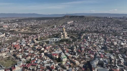 Aerial view of Holy Trinity Cathedral Sameba in Tbilisi Georgia. Sunrise drone footage.