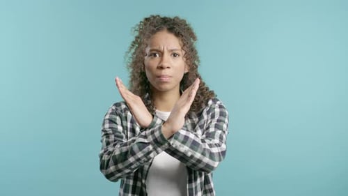 No Never Pretty African American Teen Girl Disliking and Rejecting Gesture By Stop Crossing Hands