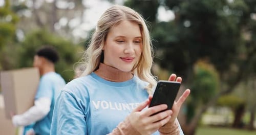 Phone, chat and volunteer woman in park with contact, planning and support in sustainable project