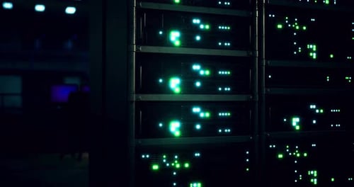 Network Server Room Displaying Vibrant Lights and Technology at Night
