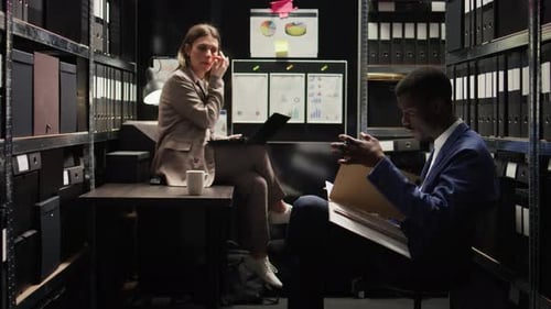 Colleagues Working Together in a Small Office