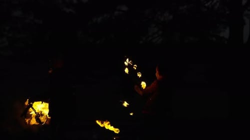 Fire Jugglers Perform at Night