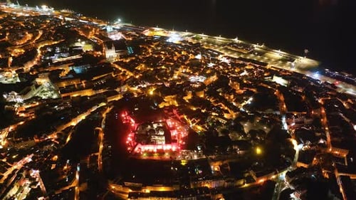 Night view of illuminated Lisbon streets and landmarks