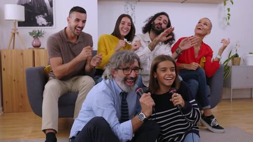 Family and Friends Sing Karaoke Together at Home