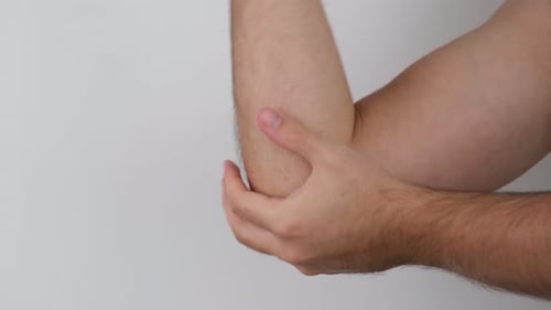 Hand Massaging and Soothing Sore Elbow