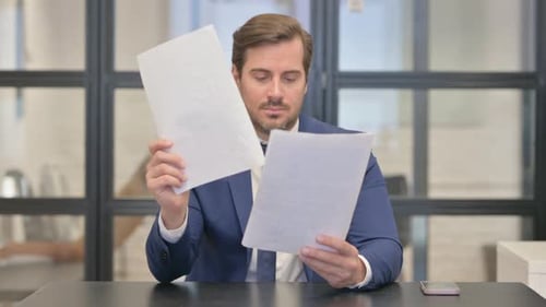 Businessman Receives Good News From Documents