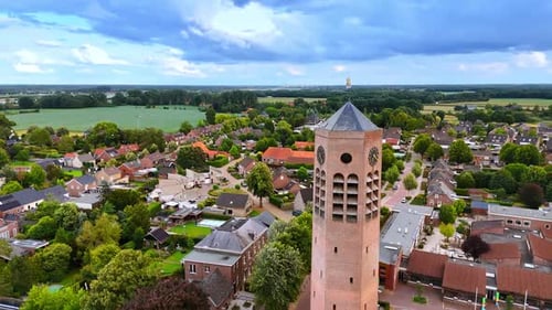 Flight around the tower with clock of Saint Lawrence Church.