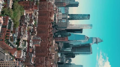 Vertical video ascending aerial of new york skyline manhattan