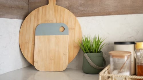 Stylish Kitchen Still Life with Cutting Boards and Plant