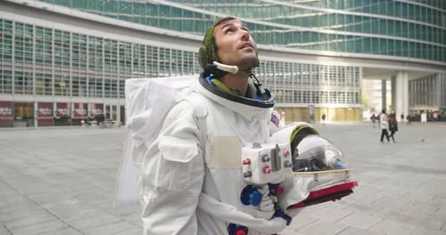 An astronaut just landed from space, on the new planet, walks in the middle of a road to explore t