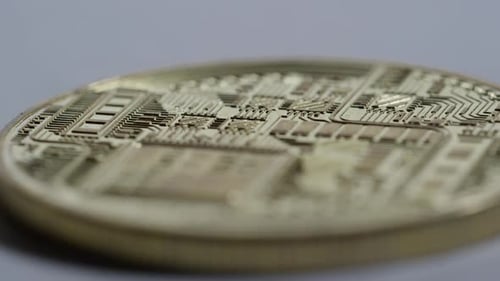 Crypto Currency - Rack focus macro across a bit coin