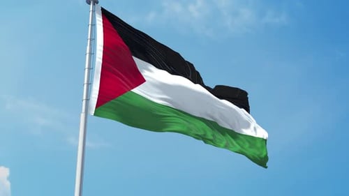 Waving Palestinian Flag Against Clear Blue Sky