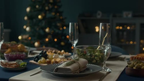 Festive Dinner Table with Christmas Tree Background