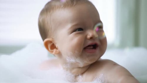 Happy Baby Laughing in Bubble Bath