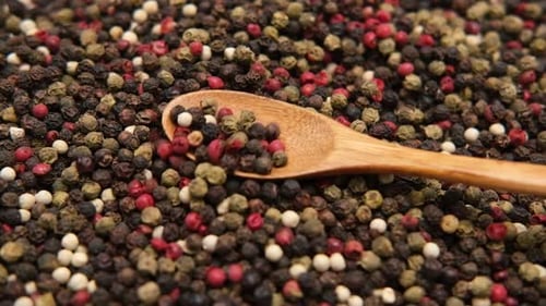 Close Up of Mixed Peppercorns With Spoon