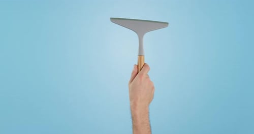 Window, cleaning and janitor hand washing glass surface for hygiene isolated in a studio blue