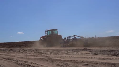Tractor on the Farmer's Field Plows and Cultivates the Soil Agriculture Farming Business Harvest
