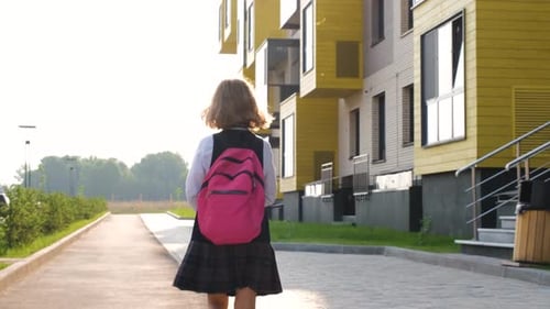 Schoolgirl with Backpack Running to Classes