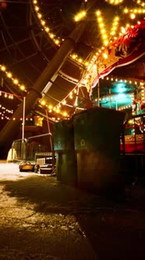 Glowing Carnival Ride Lights at Night Vertical Video