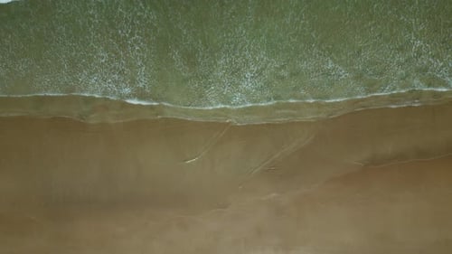 Sea Waves Breaking on Sand Beach