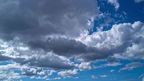 Billowing Clouds Floating Across a Blue Sky
