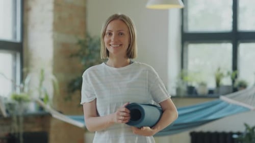 Portrait of Smiling Woman in Yoga Studio
