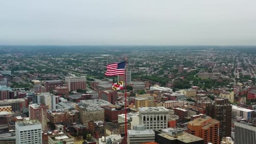 City Skyline with American and Maryland Flags Waving