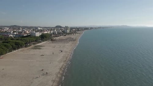 Very quiet tourism day on sunny Adriatic sand beach in Durres, Albania