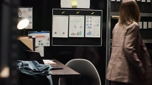 Inspector Examining Evidence in Office