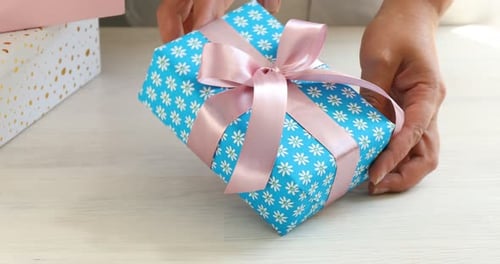 Unwrapping A Beautiful Gift with Light Blue Wrapping