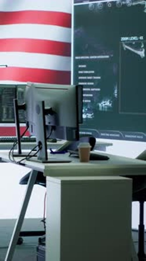 Office Setting with Monitors Displaying Information