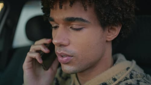 Young Adult Talking on Phone in Car Close Up