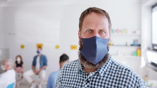 Man Wearing Face Mask in Waiting Room